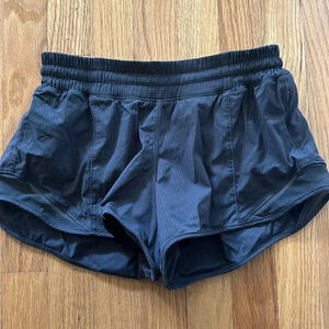 Lululemon sz 4 Hotty Hot shorts dark grey with stripes great pre owned condition